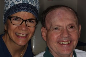 Dr. Elaine Torres-Melendez and a patient showing off their new dental crowns with a smile