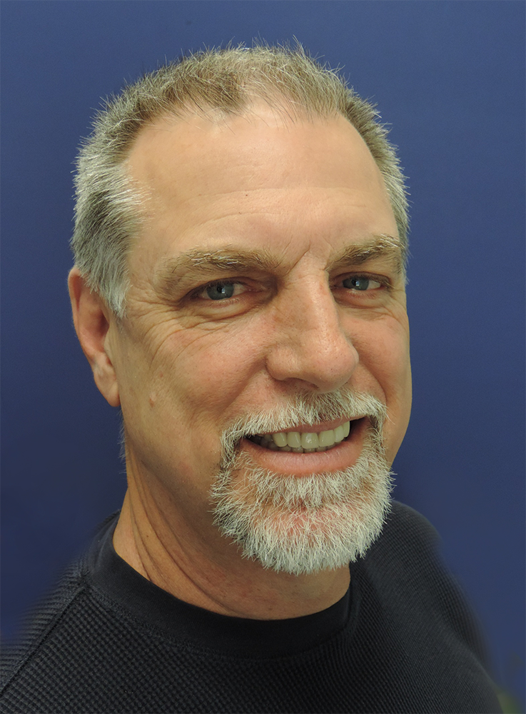 A smiling older man with a striking smile after full mouth reconstruction